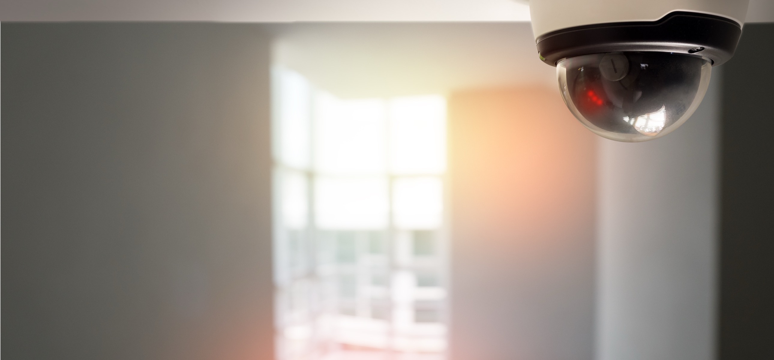 Dome surveillance camera installed on a ceiling